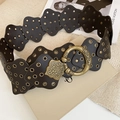 Detail of vintage brown wide belt with scalloped edges and retro brass ring buckle - Brown
