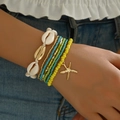 Böhmisches Mehrlagen-Armband-Set mit weißen Muscheln, Sternanhängern und bunten Perlen - 7-teiliges Set / Gelb