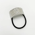Close-up of silver zinc alloy hair tie with irregular textured surface and black elastic band - Wrinkled Silver Square