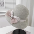 Detailed view of the fine woven texture and elegant double layered bow on a grey straw hat - 57.5cm (Adjustable) / Grey (Satin Bow)