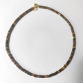 Detail of natural tiger eye stone disc beads with gold spacers and lobster clasp - Yellow Brown Tiger Eye Texture