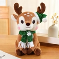 Plush Christmas reindeer toy with green festive hat and snowflake scarf in a cozy setting - Dark Brown - Sequin Green Scarf / 30cm