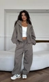 Detail of taupe drawstring elastic waistband on high-waisted baggy sweatpants - S / Gray