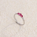 Silver titanium steel ring featuring three round fuchsia gemstones in a linear setting - Steel Color with Rose Red Zirconia