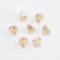 Detail shot of faceted light amber crystal glass bell pendants with multi-cut finish - Amber Gold