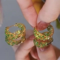 Exquisite gold-plated hoop earrings featuring multi-row pave-set green cubic zirconia crystals - Gold Green