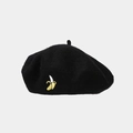 Detail of yellow banana embroidery on a black wool beret hat with a minimalist design - Black