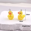 Detailed view of yellow resin duck charms with size 2.4cm and weight 2.1g measurements - AB Colorful Yellow Duck