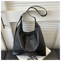 Classic black PU leather tote bag with adjustable strap and silver hardware finish - Black