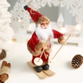 Christmas Santa Claus figurine on wooden skis wearing gold glasses and red velvet suit - Red Skiing