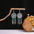 Detailed macro view of bohemian dreamcatcher earrings with turquoise beads on wood - E5122 Silver Blue Dreamcatcher