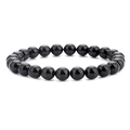 Macro shot of 8mm polished black obsidian beads on an elastic handmade bracelet - Shiny Black Agate