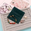 Detail of dark green velvet jewelry pouch with pearl ring and beaded bracelet set - Dark Green