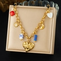 Vintage gold plated irregular heart pendant necklace with charms on display - Retro Multi-Pendant Heart Style (N4017)