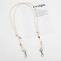 Close-up of cream leather crossbody strap with silver metal spring hook and knot detail - Silver Plate Hook / Off White