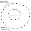 Detail view of 304 stainless steel necklace and bracelet set with black beads and charms - Black Beads Style (S-H540 S-N548)