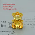 Macro detail of yellow translucent acrylic bear pendant with 29mm size and 5.2g weight - 29mm*20mm / Orange
