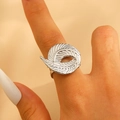 Silver feather leaf open ring with textured spiral design worn on a finger - Steel (M-414)