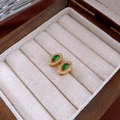 Detailed macro shot of vintage gold earrings with green stones in a luxury wooden box - Marquise Studs / Emerald Green Gold (Silver Pin)