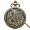 Vintage bronze pocket watch with intricate scale pattern cover and metal chain - Bronze - Radial Scale Pattern