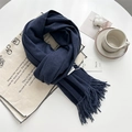 Soft navy blue tassel scarf laid on a canvas bag with cozy coffee lifestyle props - Navy Blue