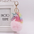 Close-up of unicorn keychain with glitter leather, tulle mane and soft pink pom pom - Unicorn (Gold Chain Buckle) / Light Pink