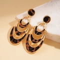 Detail view of gold layered oval earrings with faux hair leopard print on natural stone - Leopard Triple Layer Drop Earrings