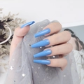 Detail of glossy sky blue extra-long coffin nails on a hand with sequin fabric - Sky Blue (CBLL-06)