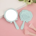 Light blue rose-shaped handheld vanity mirrors with elegant floral relief design - Solid Blue