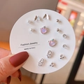 Close-up of 8-pair silver earring set with butterfly, pearl and rhinestone heart charms - Silver Pink Rhinestone Butterfly (E0065-1)