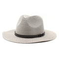 Close-up of woven straw fedora with decorative black leather band and metal studs - Gray