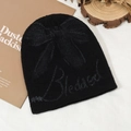 Black knit beanie featuring a grey butterfly pattern and Blessed text embroidery - Black