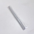 Detail shot of a grey bohemian hand-woven cotton curtain tieback in clear packaging - Long Style / Cotton Light Grey