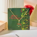 Golden Christmas tree necklace with colorful crystals on a festive green gift card - Colorful Christmas Tree