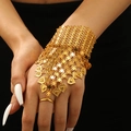Detailed view of golden hand harness with hollow mesh strap and heart pendants - Heart Pendant Style (7698) / Gold