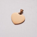 Polished rose gold heart-shaped stainless steel pendant with clasp on white surface - Rose Gold