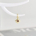 Minimalist gold eight-pointed star pendant with red gemstone on a white branch - Gold with Red Zirconia