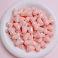 Macro view of pink iridescent resin bow beads for DIY jewelry and phone chain crafts - Sold per piece / Coral