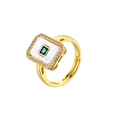 Detail of square emerald gemstone ring with diamond halo and 18K gold plated band - Square Green Zirconia Ring