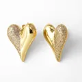 Macro shot of 18k gold plated heart earrings with white cubic zirconia micro-pave - Asymmetric Pave Heart Style (C)