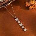 Detailed macro view of 925 silver butterfly pendant necklace with square zircon stones - Silver Small Butterfly Tassel