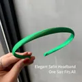 Slim emerald green satin headband featuring a smooth glossy finish for a minimalist style - Light Green