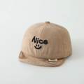 Detail of embroidered 'Nice' and smiley on khaki faux suede baby baseball hat - Nice / Khaki