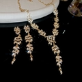 Close-up of golden wheat leaf jewelry set with sparkling rhinestones and tassels - 2-Piece Necklace & Earrings Set / Gold