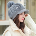 Chic grey plush winter cap for women featuring cute fur pompom and protective ear flaps - One Size / Gray