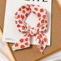 Cotton and linen square scarf with red floral print on white, knotted for styling - Adenium White Base