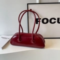 Minimalist deep red underarm bag in glossy finish with long handles and sleek design - Burgundy