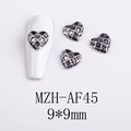 Macro view of 9x9mm silver heart grid nail charms with vintage metallic finish - Black and White Grid Heart Style (AF45)