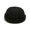 Detalle de las costuras de seis paneles y la textura mate de un gorro docker negro - M (56-58cm) / Negro