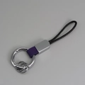 Portachiavi in pelle viola e treccia nera con moschettone ad anello argento per auto - Viola + Argento